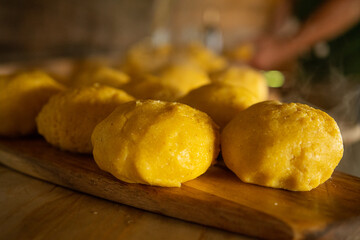 Polenta with aged fermented sheep cheese inside represents a traditional romanian food