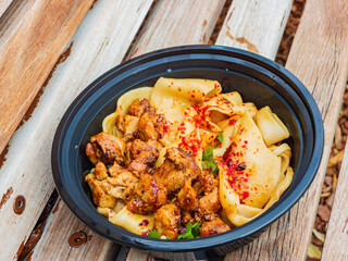Close up shot of hand pulled noodle with chicken