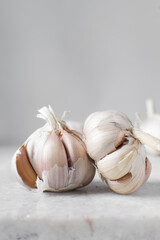 Garlic bulbs on a marble tray, garlic, raw garlic, Allium sativum