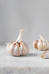 Garlic bulbs on a marble tray, garlic, raw garlic, Allium sativum