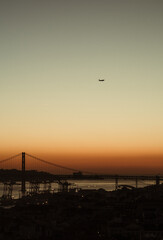 Fototapeta na wymiar sunset view of a bridge with a plain