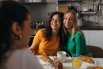 Female friends hanging out together and looking at the camera