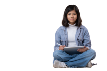 Mexican girl sitting on the floor with tablet and stylus pen