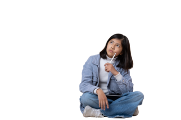 Mexican girl sitting on the floor thinking expression with tablet and stylus pen