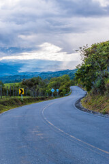 Fototapeta na wymiar Beautiful asphalt road in the countryside. Landscape with long road in Colombia.