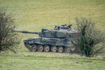 close-up of a British army FV4034 Challenger 2 ii main battle tank in action on a military combat exercise, Wiltshire UK