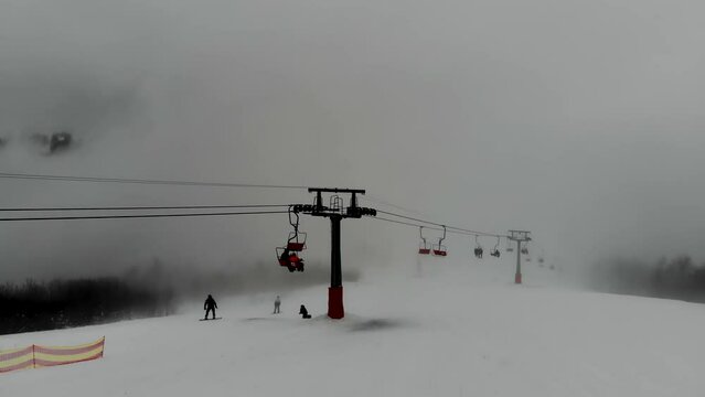 Shot from the drone of the funicular to the Himba mountain. Ski resort Pylypets in the Carpathians of Ukraine. Prepared tracks for skiers and snowboarders. The longest ski run in Ukraine. Cableway