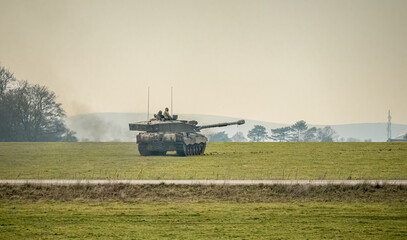 Fototapeta premium British army FV4034 Challenger 2 ii main battle tank in action, gun turret rotated to side, Wiltshire UK