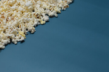Popcorn texture on a blue background.