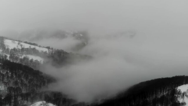 Drone shot of people skiing on Mount Himba. Ski resort Pylypets in the Carpathians of Ukraine. Prepared tracks for skiers and snowboarders.The longest ski run in Ukraine. Cableway- Borzhava lifts