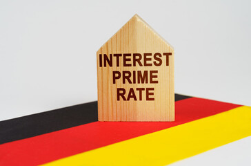 On the flag of Germany there is a model of a wooden house with the inscription - INTEREST PRIME RATE