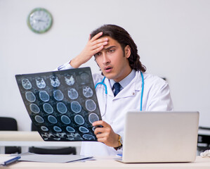 Young male doctor radiologist working in the clinic