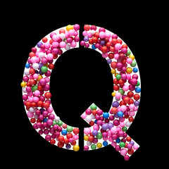 Capital letter Q made of multi-colored balls, isolated on a black background.