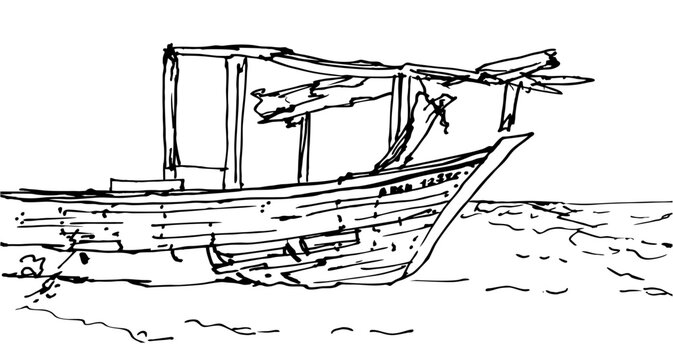 Traditional old fishing boat next to a hut on the sea beach of Cubagua Island, Venezuela