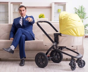 Young businessman looking after baby
