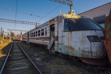 Fototapeta na wymiar Old abandoned broken high speed train on railway