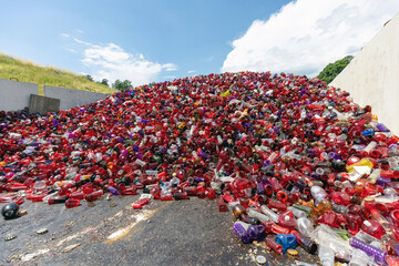 Big heap of waste collected after All Saints Day, plastic tombstone lanterns sorted for recycling treatment, Used grave candles