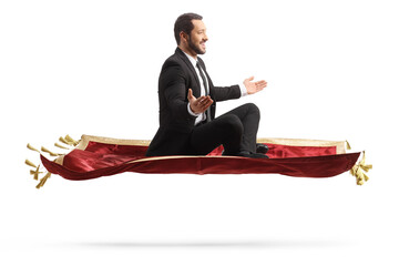 Profile shot of a businessman flying on a red carpet