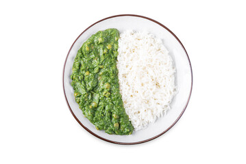 Spinach dahl with rice in a plate on a white isolated background
