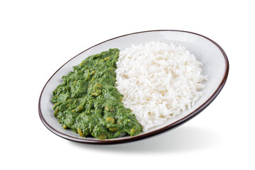 Spinach dahl with rice in a plate on a white isolated background