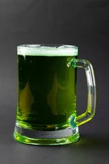 Fotobehang Image of glass with green beer and copy space on grey background © vectorfusionart