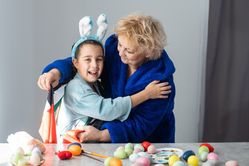 grandmother and granddaughter with uae flag for easter