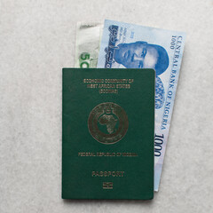 The new Nigerian 1000 and 500 Naira notes in a nigerian passport, Nigeria's new currency in a passport