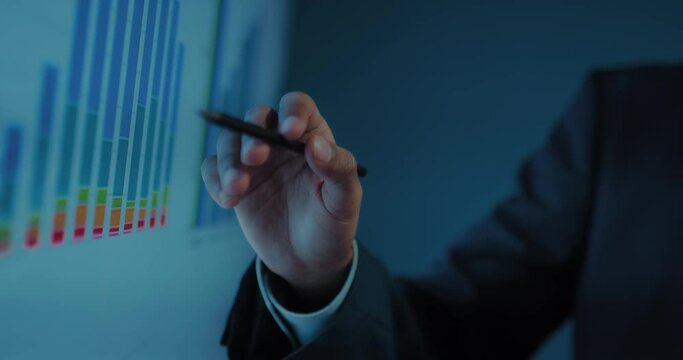 closeup view of hands of african businessman showing profit chart in business meeting, 4K, Prores