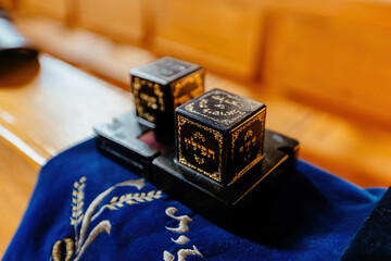 A pair of tefillin on a synagogue bench