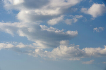 Cloudscape - Blue sky and white clouds, wide panorama.
