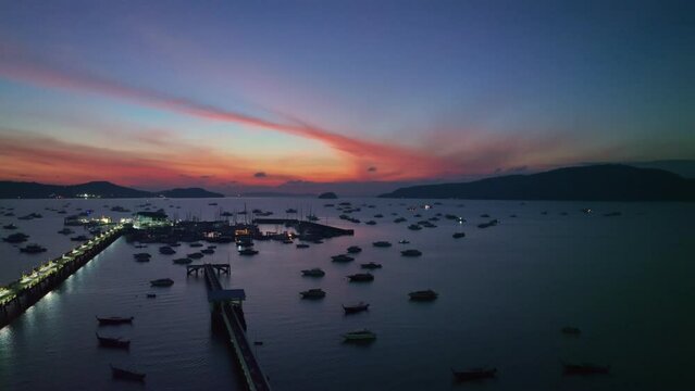 aerial view Chalong gulf in colorful of twilight. .first light above archipelago in chalong gulf Phuket thailand..4k stock footage video in travel concept.