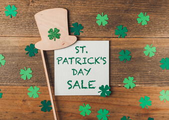 St.Patrick's day sale on wooden background