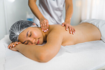 Fototapeta na wymiar Beautiful woman getting a back massage in spa. High quality photo