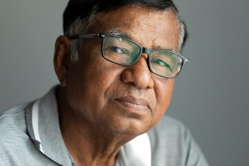 Close-up face of elderly man asian with sad expression, portrait