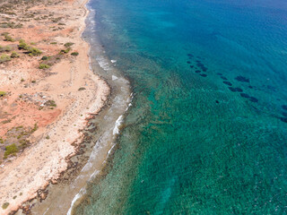 Beautiful azure sea and sandy shore. Warm summer photo. Top view, drone filming.