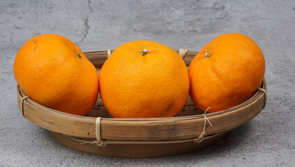 Healthy fruits, orange fruits in bamboo plate