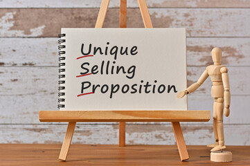 There is notebook with the word Unique Selling Proposition. It is an eye-catching image.