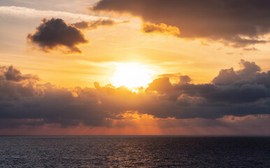 Fototapeta premium Dramatic Colorful Sunset Sky over Mediterranean Sea. Clouds with Sunrays. Cloudscape Nature Background.