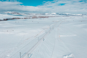 beautiful sky and snowy train track