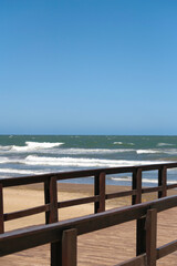 Combination between pier and sea, contemplating the horizon, vertical photo