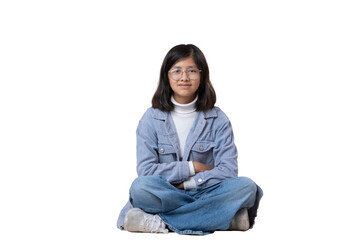 Mexican 12 year old girl sitting on the floor looking at camera