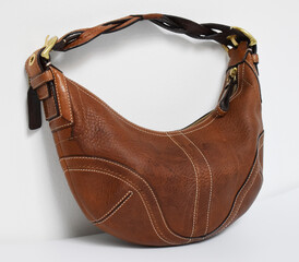 90s vintage brown leather hobo bag isolated on white