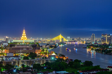 Sappaya Sapasathan is the parliament building and Rama 8 bridge in the nights is the cityscape of Bangkok Thailand.