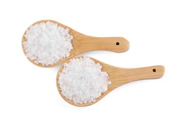 Wooden spoons with natural sea salt isolated on white, top view