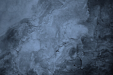 Old painted concrete wall surface. Close-up. Gray pale dysty blue color. Rough dark grunge background for design. Distressed, broken, cracked, crumbled. © Наталья Босяк