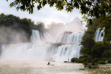 Sunset at Detian Waterfalls in China, also known as Ban Gioc in Vietnam is the fourth largest...
