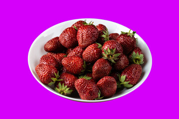 Fresh ripe delicious strawberries in a white plate on a isolated background