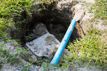 Digging and repairing water supply pipes in the lawn for new installations