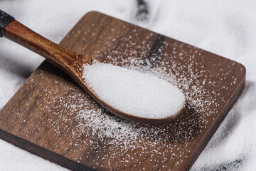 close up of salt in wooden spoon background