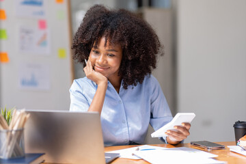 Young pensive female in afro hairstyle thinking of new creative ideas